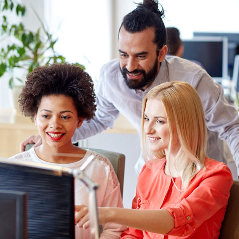 3 people looking at the computer screen